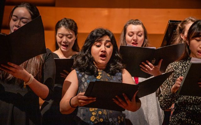 A group of people singing.