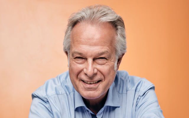 A man in a blue shirt.