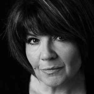 A woman with short dark hait.