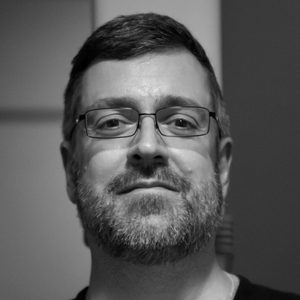 Artur Pizarro A man with short hair and glasses.