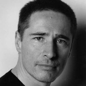 A man with short dark hair.