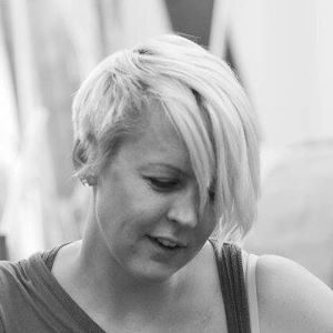 A blonde woman with a long fringe.