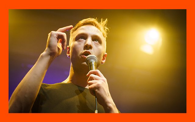 Man singing into microphone