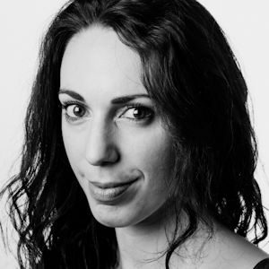 A woman with shoulder length dark hair.