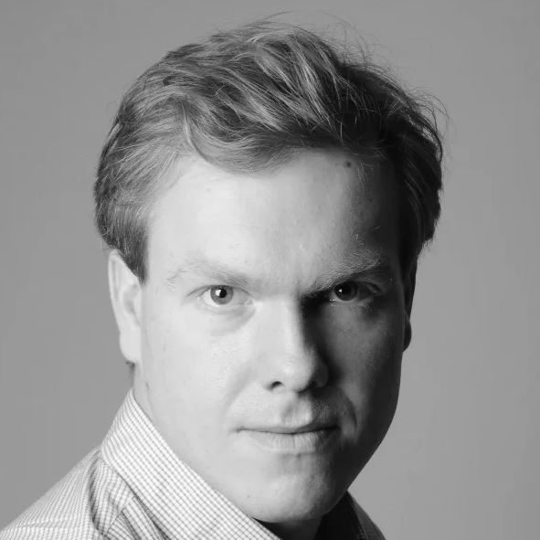 Dominc Bevan 300 x 300 A man with short hair wearing a shirt.