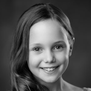 A girl with her hair over her right shoulder.