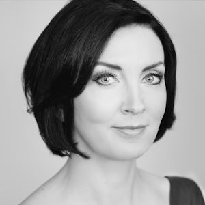 A woman with dark hair.