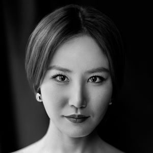 A picture of a woman looking into the camera intently