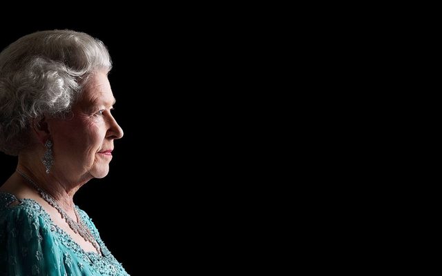 A face profile portrait of Queen Elizabeth II. She is wearing a blue top.