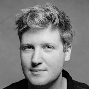 A man with wavy light hair.