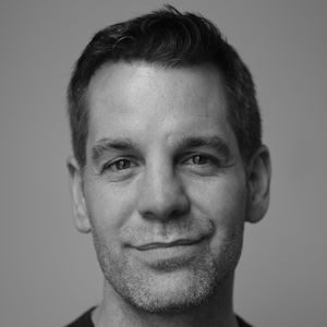 John Hopkins 300 x 300 A man with a bit of stubble and short hair.