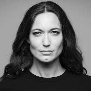 A woman with shoulder length dark hair.