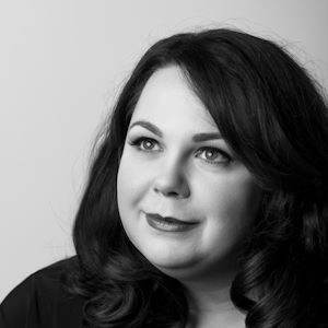 A picture of a woman with long hair looking into the distance