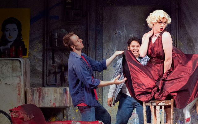 The cast of Opera North performing La Boheme on stage