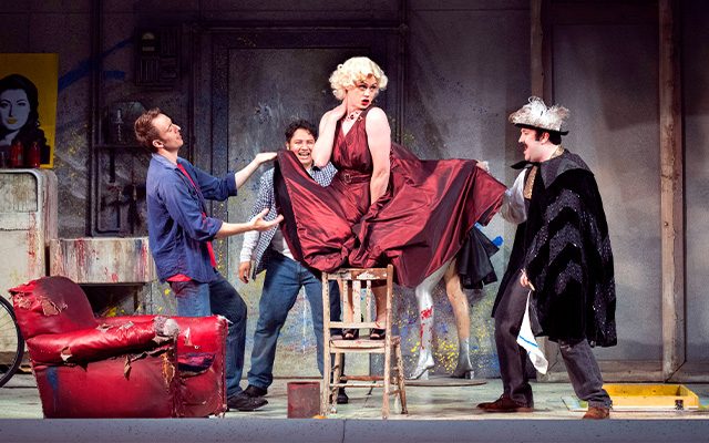 The cast of Opera North performing La Boheme on stage