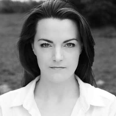 Black and white headshot of Maire Flavin