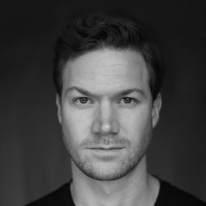 A man with short hair.
