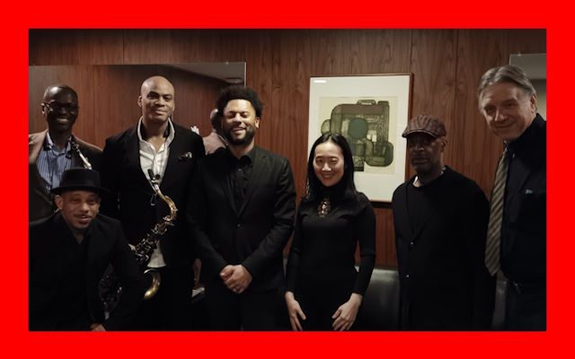 A big band all dressed in black.