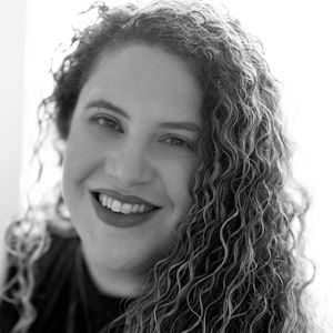 A woman with long curly hair.