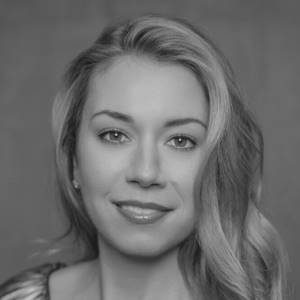 A close up photograph of a woman with light hair