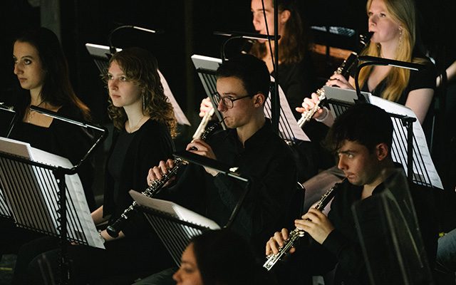 A group of young people playing instruments.