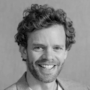A man with curly hair,