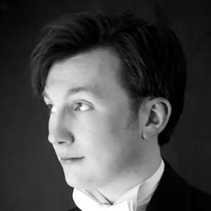 Phil Clieve 300 x 300 A man wearing a shite shirt and bow tie.