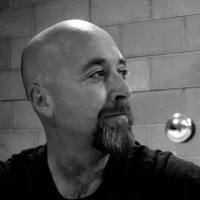 A bald man with a goatee.