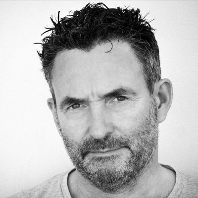 A man with short hair and a beard.