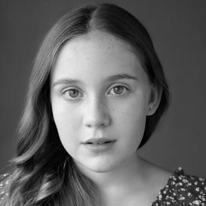A girl with shoulder-length hair.