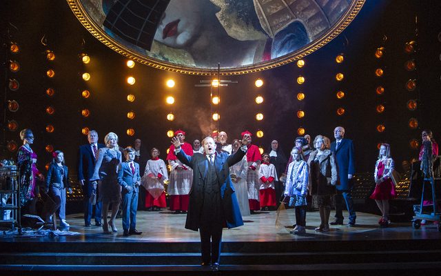 Robert Hayward as Scarpia and the Chorus of Opera North © Richard H Smith