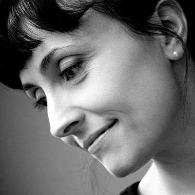 A woman with dark hair.