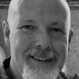 A bald man with a goatee.