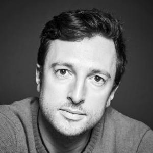 Dingle Yandell A man with dark hair wearing a jumper.