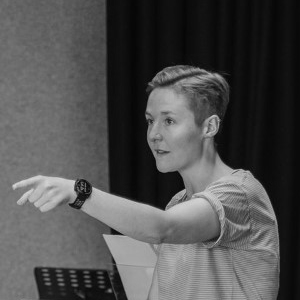 Ellie Slorach A woman wearing a watch pointing.