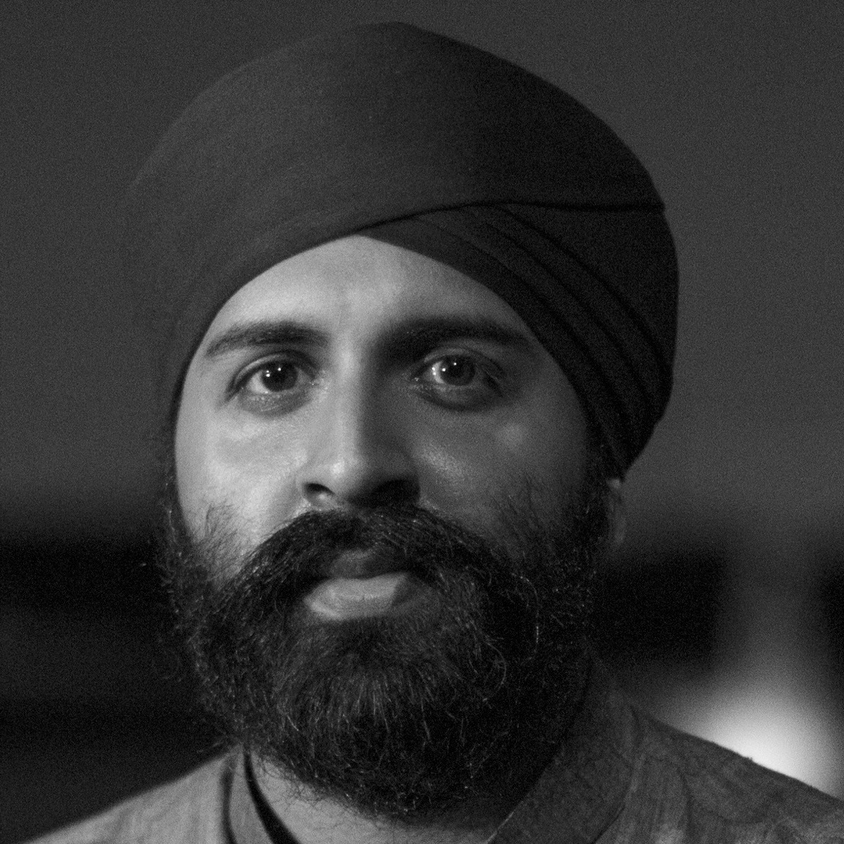 kaviraj-singh A man with a beard and wearing a black turban.