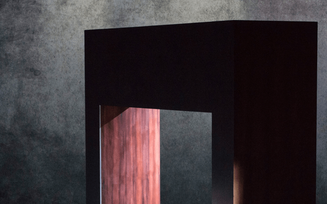 A large square arch on a stage.